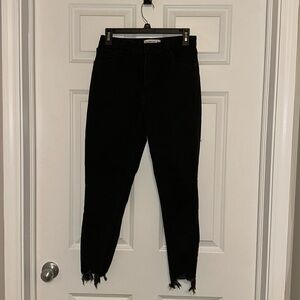 Abercrombie and Fitch Super Skinny Ankle High Rise Jean with frayed bottom.